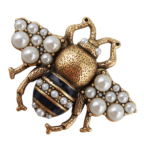 Брошь (Майорка белая, эмаль черная; покрытие античное золото)